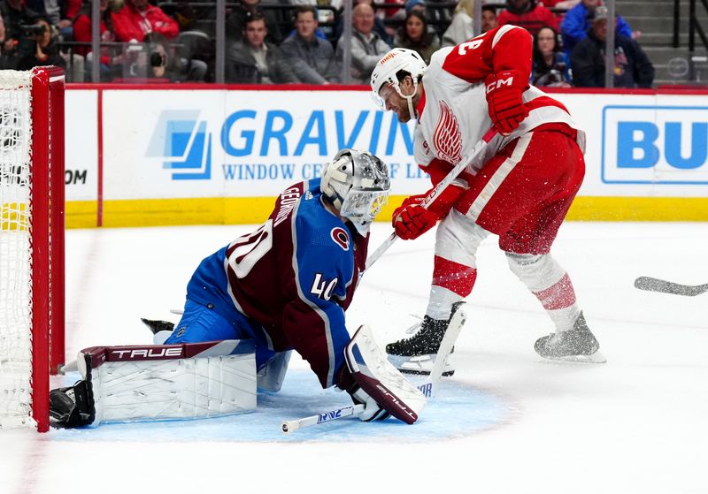 Mar 6, 2024; Denver, Colorado, USA; Colorado Avalanche goaltender Alexandar Georgiev (40) makes a save on Detroit Red Wings right wing Christian Fischer (36) in the third period at Ball Arena. Mandatory Credit: Ron Chenoy-USA TODAY Sports