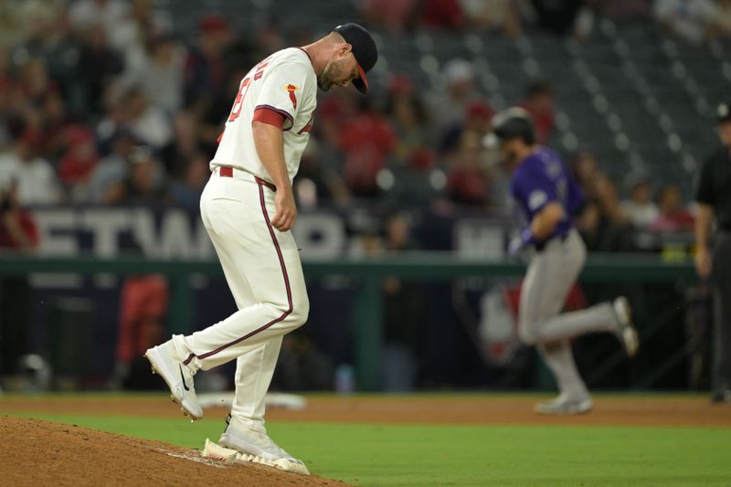 Aug 1, 2024; Anaheim, California, USA;  Los Angeles Angels relief pitcher Hunter Strickland (61) stands on the mound after giving up a two-run home run to Colorado Rockies right fielder Jake Cave (11) in the tenth inning at Angel Stadium. Mandatory Credit: Jayne Kamin-Oncea-USA TODAY Sports