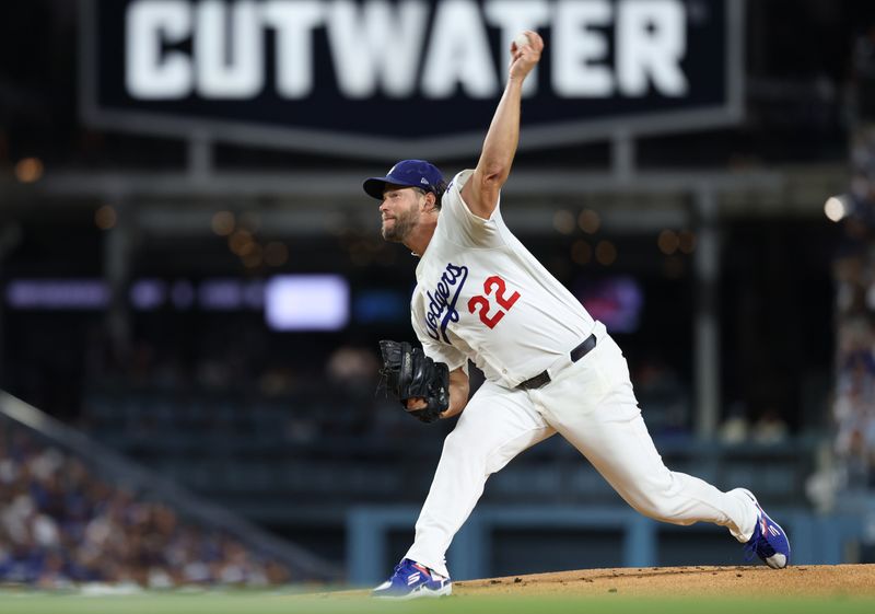 Sep 19, 2025; Los Angeles, California, USA; Los Angeles Dodgers pitcher Clayton Kershaw (22) throws during the first inning against the San Francisco Giants at Dodger Stadium. Mandatory Credit: Kiyoshi Mio-Imagn Images