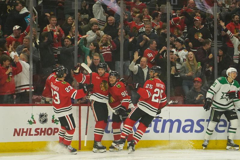 Nov 27, 2024; Chicago, Illinois, USA; Chicago Blackhawks left wing Taylor Hall (71) celebrates his goal against the Dallas Stars with his teammates during the first period at United Center. Mandatory Credit: David Banks-Imagn Images