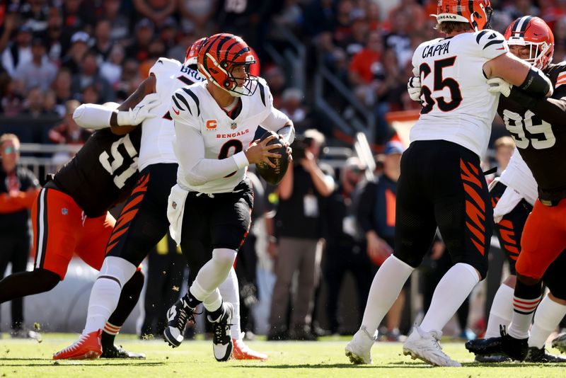 Cincinnati Bengals quarterback Joe Burrow (9) looks to throw the ball during an NFL football game against the Cleveland Browns, Sunday, Oct. 20, 2024, in Cleveland. (AP Photo/Kirk Irwin)