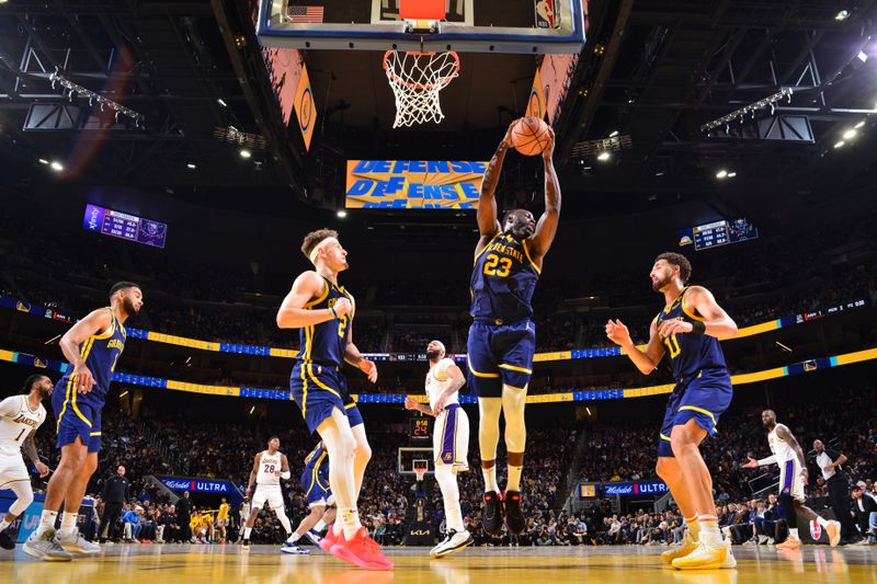 SAN FRANCISCO, CA - JANUARY 27:  Andrew Wiggins #22 of the Golden State Warriors grabs a rebound during the game against the Los Angeles Lakers on January 27, 2024 at Chase Center in San Francisco, California. NOTE TO USER: User expressly acknowledges and agrees that, by downloading and or using this photograph, user is consenting to the terms and conditions of Getty Images License Agreement. Mandatory Copyright Notice: Copyright 2024 NBAE (Photo by Barry Gossage/NBAE via Getty Images)