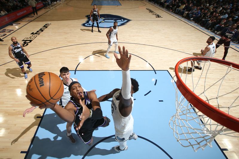 MEMPHIS, TN - DECEMBER 5: Issac Jones #17 of the Sacramento Kings drives to the basket during the game against the Memphis Grizzlies on December 5, 2024 at FedExForum in Memphis, Tennessee. NOTE TO USER: User expressly acknowledges and agrees that, by downloading and or using this photograph, User is consenting to the terms and conditions of the Getty Images License Agreement. Mandatory Copyright Notice: Copyright 2024 NBAE (Photo by Joe Murphy/NBAE via Getty Images)