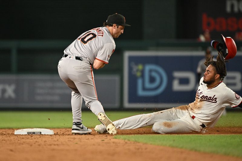 Aug 6, 2024; Washington, District of Columbia, USA; Washington Nationals left fielder James Wood (29) slides into second base in front of San Francisco Giants shortstop Casey Schmitt (10) during the sixth inning at Nationals Park. Mandatory Credit: Rafael Suanes-USA TODAY Sports