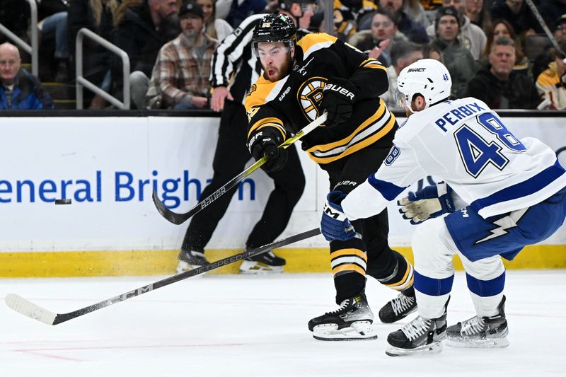 Jan 14, 2025; Boston, Massachusetts, USA; Boston Bruins right wing Justin Brazeau (55) takes a shot past Tampa Bay Lightning defenseman Nick Perbix (48) during the first period at the TD Garden. Mandatory Credit: Brian Fluharty-Imagn Images