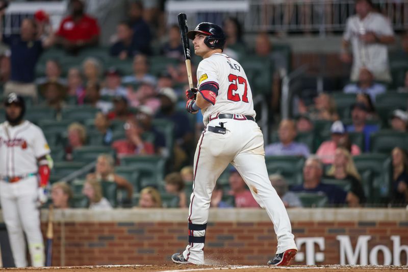 Aug 7, 2024; Atlanta, Georgia, USA; Atlanta Braves third baseman Austin Riley (27) hits a two-run home run against the Milwaukee Brewers in the fifth inning at Truist Park. Mandatory Credit: Brett Davis-USA TODAY Sports
