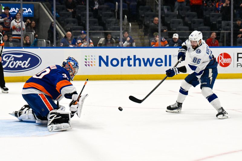 Dec 13, 2025; Elmont, New York, USA; New York Islanders goaltender Ilya Sorokin (30) makes a save on Tampa Bay Lightning right wing Nikita Kucherov (86) during shoot outs at UBS Arena. Mandatory Credit: Dennis Schneidler-Imagn Images