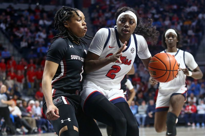 Feb 19, 2023; Oxford, Mississippi, USA; Mississippi Rebels guard Marquesha Davis (2) drives to the basket as South Carolina Gamecocks guard Zia Cooke (1) defends during the second half at The Sandy and John Black Pavilion at Ole Miss. Mandatory Credit: Petre Thomas-USA TODAY Sports