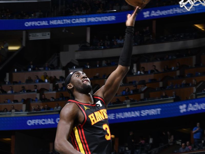 ORLANDO, FL - FEBRUARY 10: Caris LeVert #3 of the Atlanta Hawks drives to the basket during the game against the Orlando Magic on February 10, 2025 at Kia Center in Orlando, Florida. NOTE TO USER: User expressly acknowledges and agrees that, by downloading and or using this photograph, User is consenting to the terms and conditions of the Getty Images License Agreement. Mandatory Copyright Notice: Copyright 2025 NBAE (Photo by Gary Bassing/NBAE via Getty Images)