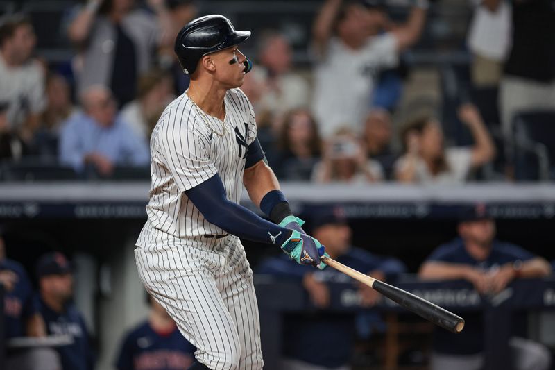 Sep 13, 2024; Bronx, New York, USA; New York Yankees center fielder Aaron Judge (99) looks up at his grand slam home run during the seventh inning against the Boston Red Sox at Yankee Stadium. Mandatory Credit: Vincent Carchietta-Imagn Images