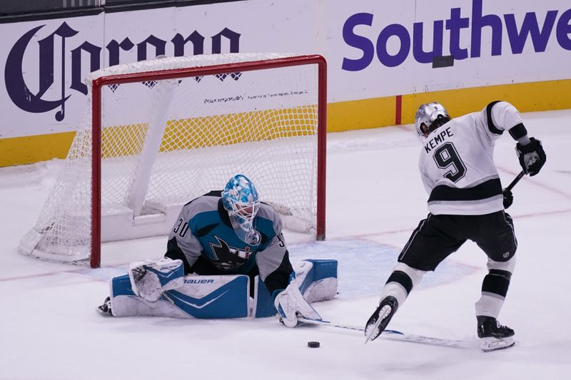 Nov 20, 2025; San Jose, California, USA;  San Jose Sharks goaltender Yaroslav Askarov (30) stops a shot on goal by Los Angeles Kings right winger Adrian Kempe (9) during the shoot out at SAP Center at San Jose. Mandatory Credit: David Gonzales-Imagn Images