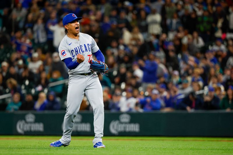 Apr 13, 2024; Seattle, Washington, USA; Chicago Cubs relief pitcher Adbert Alzolay (73) celebrates following the final out of 4-1 victory against the Seattle Mariners at T-Mobile Park. Mandatory Credit: Joe Nicholson-USA TODAY Sports