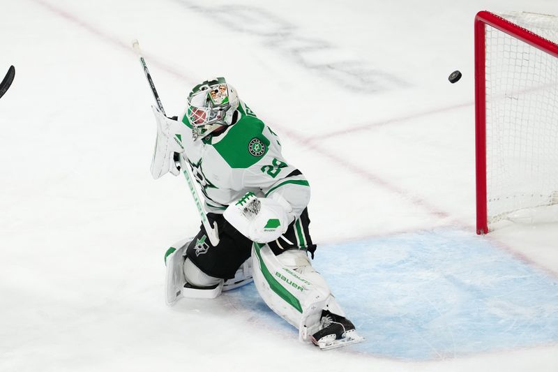 Dec 6, 2024; Las Vegas, Nevada, USA; A Vegas Golden Knights shot deflects off the cross bar behind Dallas Stars goaltender Jake Oettinger (29) during the third period at T-Mobile Arena. Mandatory Credit: Stephen R. Sylvanie-Imagn Images