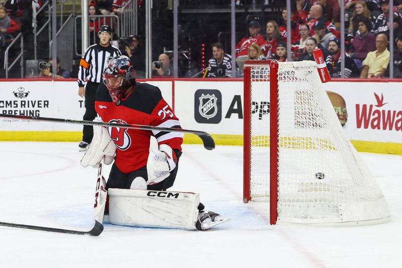 Oct 10, 2024; Newark, New Jersey, USA; Toronto Maple Leafs center Bobby McMann (74) (not shown) scores a goal on New Jersey Devils goaltender Jacob Markstrom (25) during the first period at Prudential Center. Mandatory Credit: Ed Mulholland-Imagn Images