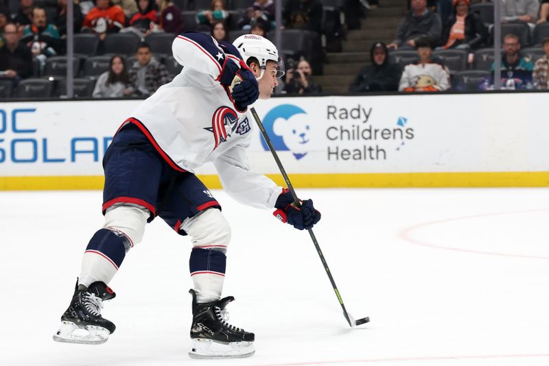 Dec 20, 2025; Anaheim, California, USA;  Columbus Blue Jackets defenseman Denton Mateychuk (5) shoots the puck during the third period against the Anaheim Ducks at Honda Center. Mandatory Credit: Kiyoshi Mio-Imagn Images