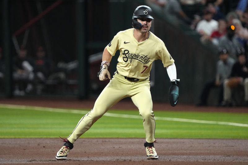 Sep 24, 2024; Phoenix, Arizona, USA; Arizona Diamondbacks outfielder Corbin Carroll (7) leads off first base against the San Francisco Giants in the first inning at Chase Field. Mandatory Credit: Rick Scuteri-Imagn Images