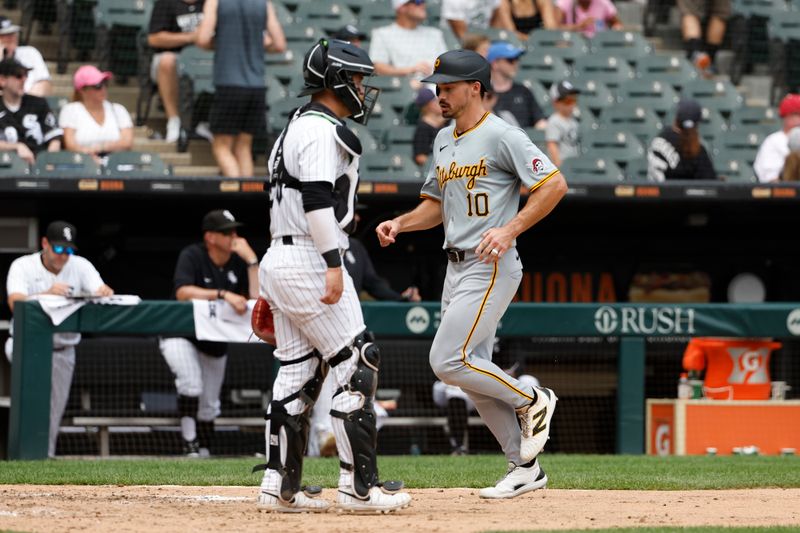 Jul 14, 2024; Chicago, Illinois, USA; Pittsburgh Pirates outfielder Bryan Reynolds (10) scores against the Chicago White Sox during the seventh inning at Guaranteed Rate Field. Mandatory Credit: Kamil Krzaczynski-USA TODAY Sports