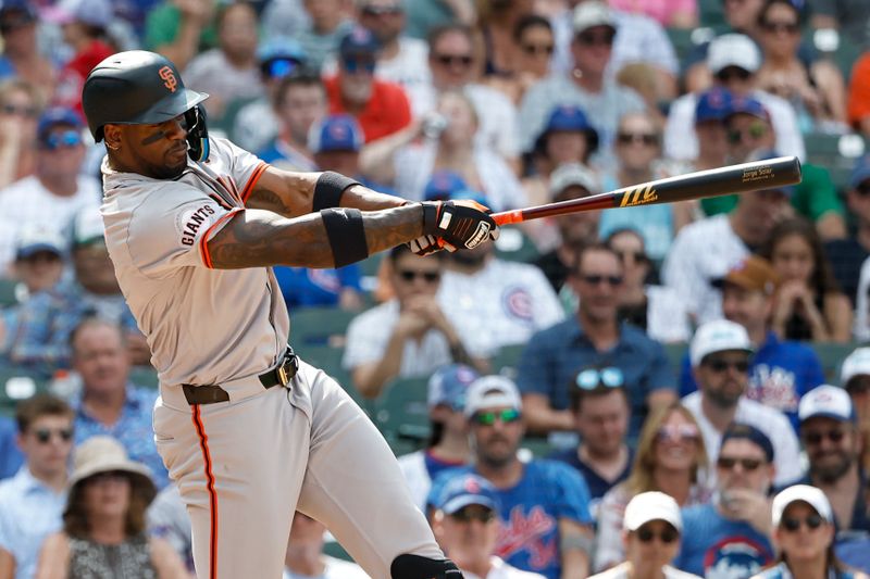 Jun 19, 2024; Chicago, Illinois, USA; San Francisco Giants designated hitter Jorge Soler (2) hits a grand slam against the Chicago Cubs during the eight inning at Wrigley Field. Mandatory Credit: Kamil Krzaczynski-USA TODAY Sports