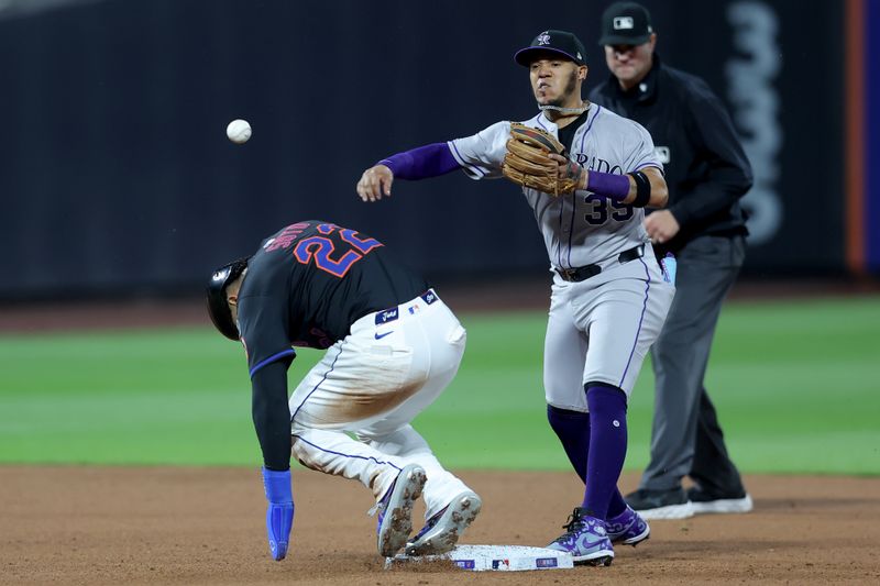May 30, 2025; New York City, New York, USA; Colorado Rockies second baseman Thairo Estrada (39) forces out New York Mets right fielder Juan Soto (22) at second base and throws to first to complete a double play on a ball hit by Mets first baseman Pete Alonso (not pictured) during the sixth inning at Citi Field. Mandatory Credit: Brad Penner-Imagn Images