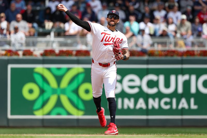 May 16, 2024; Minneapolis, Minnesota, USA; Minnesota Twins shortstop Carlos Correa (4) throws the ball to first base to get out New York Yankees Anthony Volpe (11) during the fifth inning at Target Field. Mandatory Credit: Matt Krohn-USA TODAY Sports