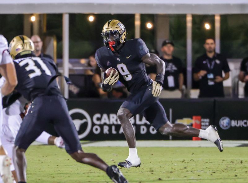 Sep 9, 2022; Orlando, Florida, USA; UCF Knights running back Jordan McDonald (9) returns a punt during the second quarter against the Louisville Cardinals at FBC Mortgage Stadium. Mandatory Credit: Mike Watters-USA TODAY Sports