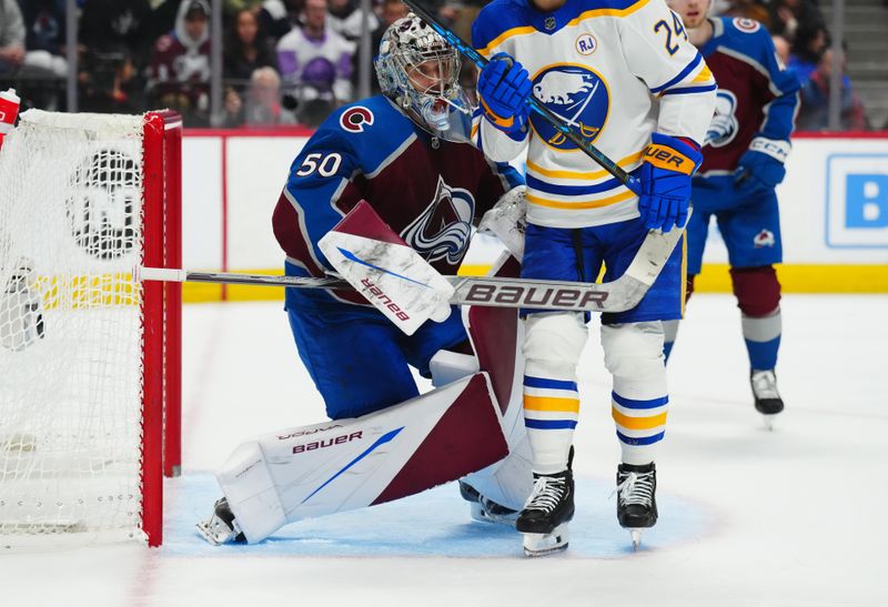 Dec 13, 2023; Denver, Colorado, USA; Buffalo Sabres center Dylan Cozens (24) shield Colorado Avalanche goaltender Ivan Prosvetov (50) during the third period at Ball Arena. Mandatory Credit: Ron Chenoy-USA TODAY Sports