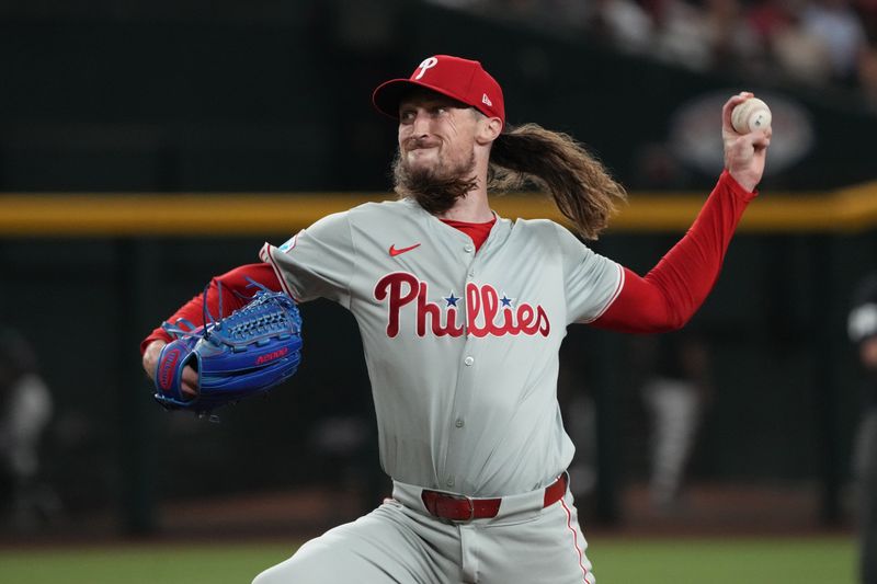 Aug 9, 2024; Phoenix, Arizona, USA; Philadelphia Phillies pitcher Matt Strahm (25) throws against the Arizona Diamondbacks in the eighth inning at Chase Field. Mandatory Credit: Rick Scuteri-USA TODAY Sports