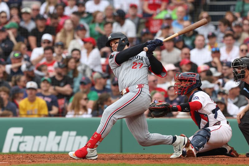 May 4, 2025; Boston, Massachusetts, USA; Minnesota Twins designated hitter Ryan Jeffers (27) hits a two run RBI single during the seventh inning against the Boston Red Sox at Fenway Park. Mandatory Credit: Paul Rutherford-Imagn Images