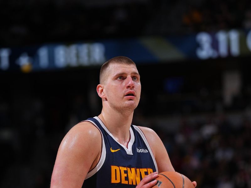 DENVER, CO - FEBRUARY 14: Nikola Jokic #15 of the Denver Nuggets shoots a free throw during the game against the Sacramento Kings on February 14, 2024 at the Ball Arena in Denver, Colorado. NOTE TO USER: User expressly acknowledges and agrees that, by downloading and/or using this Photograph, user is consenting to the terms and conditions of the Getty Images License Agreement. Mandatory Copyright Notice: Copyright 2024 NBAE (Photo by Bart Young/NBAE via Getty Images)