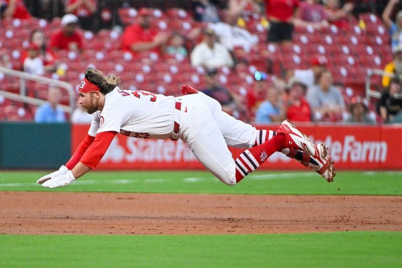 Aug 26, 2024; St. Louis, Missouri, USA;  St. Louis Cardinals second baseman Brendan Donovan (33) slides in at third for a triple against the San Diego Padres during the second inning at Busch Stadium. Mandatory Credit: Jeff Curry-USA TODAY Sports