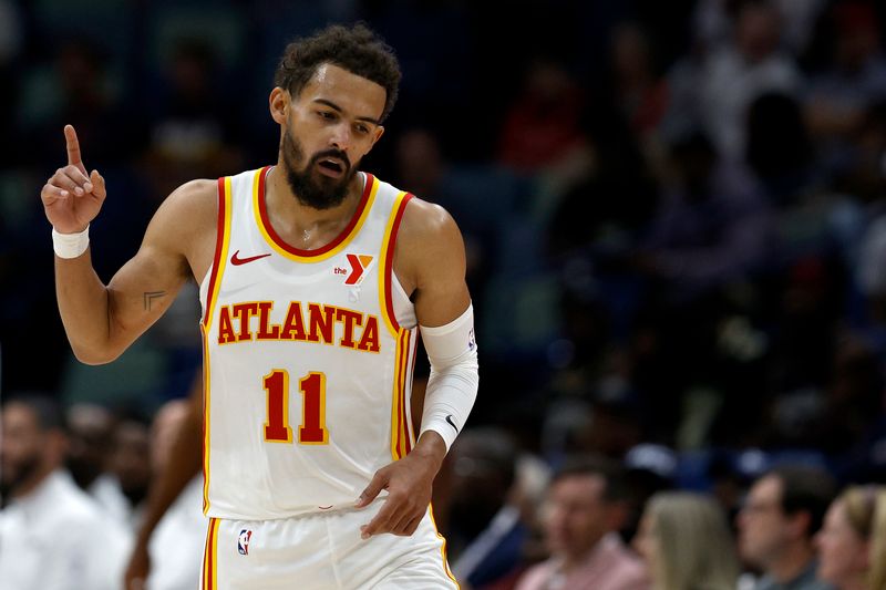 NEW ORLEANS, LOUISIANA - NOVEMBER 03: Trae Young #11 of the Atlanta Hawks reacts after scoring a three-point basket during the fourth quarter against the New Orleans Pelicans at Smoothie King Center on November 03, 2024 in New Orleans, Louisiana. NOTE TO USER: User expressly acknowledges and agrees that, by downloading and or using this photograph, User is consenting to the terms and conditions of the Getty Images License Agreement. (Photo by Sean Gardner/Getty Images)