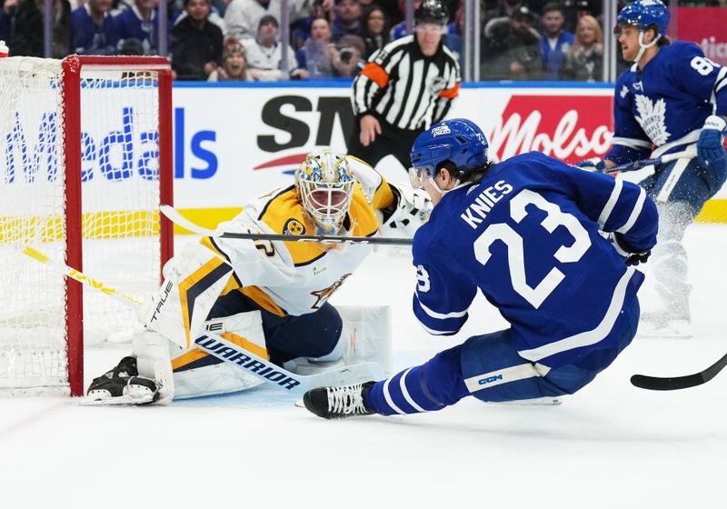 Dec 9, 2023; Toronto, Ontario, CAN; Toronto Maple Leafs left wing Matthew Knies (23) attempts a shot on Nashville Predators goaltender Kevin Lankinen (32) during the third period at Scotiabank Arena. Mandatory Credit: Nick Turchiaro-USA TODAY Sports