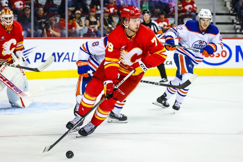 Sep 23, 2024; Calgary, Alberta, CAN; Calgary Flames right wing Cole Schwindt (79) controls the puck against the Edmonton Oilers during the third period at Scotiabank Saddledome. Mandatory Credit: Sergei Belski-Imagn Images