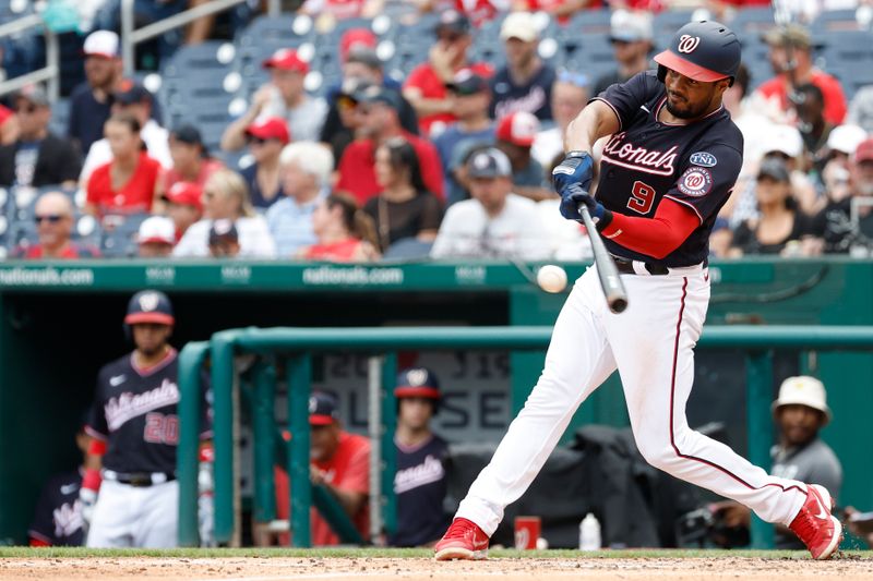 Jul 9, 2023; Washington, District of Columbia, USA; Washington Nationals third baseman Jeimer Candelario (9) singles against the Texas Rangers during the fourth inningat Nationals Park. Mandatory Credit: Geoff Burke-USA TODAY Sports