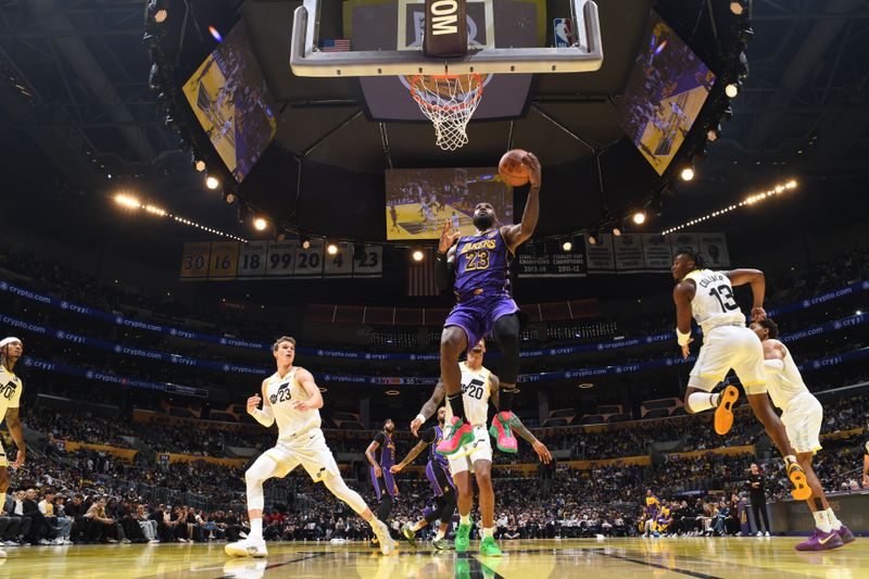 LOS ANGELES, CA - NOVEMBER 19: LeBron James #23 of the Los Angeles Lakers drives to the basket during the game against the Utah Jazz during the Emirates NBA Cup game on November 19, 2024 at Crypto.Com Arena in Los Angeles, California. NOTE TO USER: User expressly acknowledges and agrees that, by downloading and/or using this Photograph, user is consenting to the terms and conditions of the Getty Images License Agreement. Mandatory Copyright Notice: Copyright 2024 NBAE (Photo by Adam Pantozzi/NBAE via Getty Images)