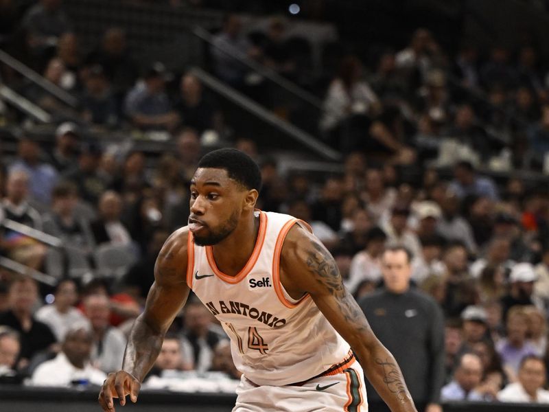 SAN ANTONIO, TX - MARCH 25: Blake Wesley #14 of the San Antonio Spurs dribbles the ball during the game against the Phoenix Suns on March 25, 2024 at the AT&T Center in San Antonio, Texas. NOTE TO USER: User expressly acknowledges and agrees that, by downloading and or using this photograph, user is consenting to the terms and conditions of the Getty Images License Agreement. Mandatory Copyright Notice: Copyright 2024 NBAE (Photos by David Dow/NBAE via Getty Images)