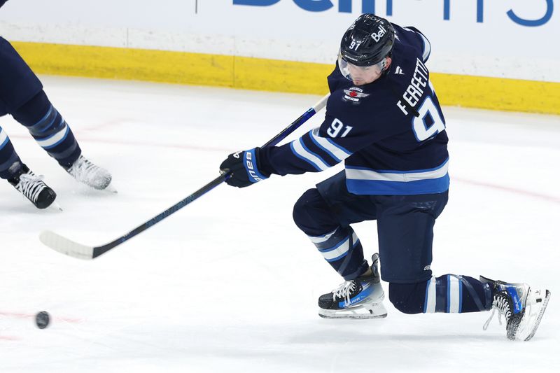 May 9, 2025; Winnipeg, Manitoba, CAN; Winnipeg Jets center Cole Perfetti (91) warms up before a game against the Dallas Stars in game two of the second round of the 2025 Stanley Cup Playoffs at Canada Life Centre. Mandatory Credit: James Carey Lauder-Imagn Images