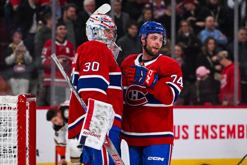 Feb 13, 2024; Montreal, Quebec, CAN; Montreal Canadiens center Brandon Gignac (74) celebrates the shootout win against the Anaheim Ducks with goalie Cayden Primeau (30) after the end of the game at Bell Centre. Mandatory Credit: David Kirouac-USA TODAY Sports