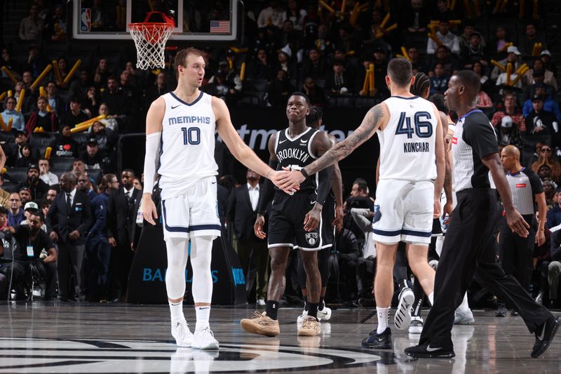 BROOKLYN, NY - MARCH 4: Luke Kennard #10 high fives John Konchar #46 of the Memphis Grizzlies during the game against the Brooklyn Nets on March 4, 2024 at Barclays Center in Brooklyn, New York. NOTE TO USER: User expressly acknowledges and agrees that, by downloading and or using this Photograph, user is consenting to the terms and conditions of the Getty Images License Agreement. Mandatory Copyright Notice: Copyright 2024 NBAE (Photo by Nathaniel S. Butler/NBAE via Getty Images)