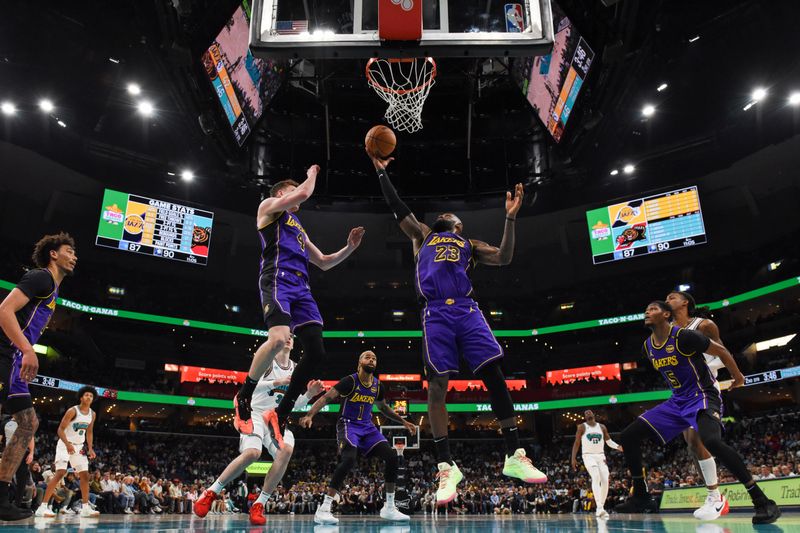 MEMPHIS, TN - NOVEMBER 6: LeBron James #23 of the Los Angeles Lakers rebounds the ball during the game against the Memphis Grizzlies on November 6, 2024 at FedExForum in Memphis, Tennessee. NOTE TO USER: User expressly acknowledges and agrees that, by downloading and or using this photograph, User is consenting to the terms and conditions of the Getty Images License Agreement. Mandatory Copyright Notice: Copyright 2024 NBAE (Photo by Grant Burke/NBAE via Getty Images)