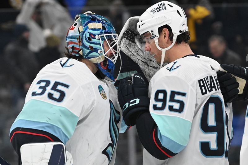 Feb 15, 2024; Boston, Massachusetts, USA; Seattle Kraken goaltender Joey Daccord (35) reacts with left wing Andre Burakovsky (95) after a game against the Boston Bruins at the TD Garden. Mandatory Credit: Brian Fluharty-USA TODAY Sports