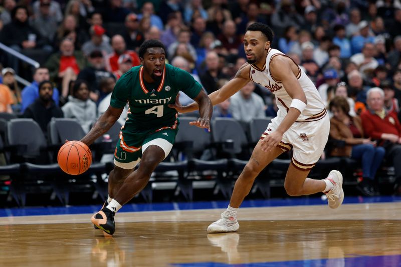 Mar 12, 2024; Washington, D.C., USA; Miami (Fl) Hurricanes guard Bensley Joseph (4) drives to the basket as Boston College Eagles guard Claudell Harris Jr. (1) defends in the first half at Capital One Arena. Mandatory Credit: Geoff Burke-USA TODAY Sports