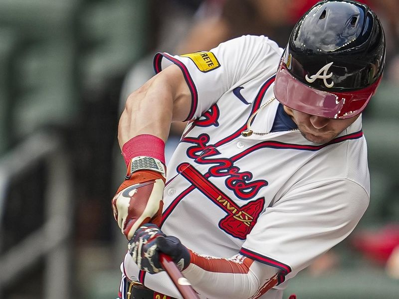 Jul 4, 2024; Cumberland, Georgia, USA; Atlanta Braves outfielder Jarred Kelenic (24) hits a single against the San Francisco Giants during the first inning at Truist Park. Mandatory Credit: Dale Zanine-USA TODAY Sports