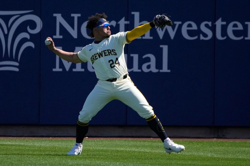 Mar 9, 2024; Phoenix, Arizona, USA; Milwaukee Brewers catcher William Contreras (24) warms up before a game against the Seattle Mariners at American Family Fields of Phoenix. Mandatory Credit: Rick Scuteri-USA TODAY Sports