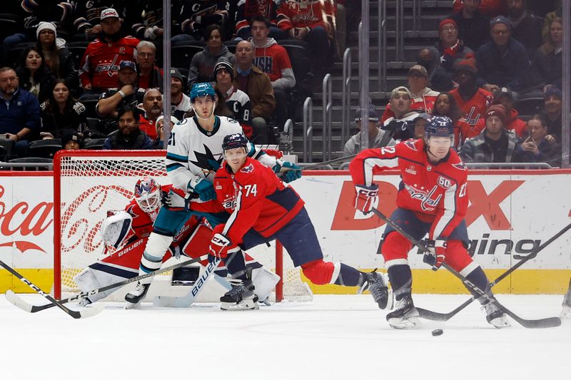 Dec 3, 2024; Washington, District of Columbia, USA; Washington Capitals defenseman John Carlson (74) and San Jose Sharks center Alexander Wennberg (21) battle for position confront of Capitals goaltender Logan Thompson (48) as Capitals right wing Brandon Duhaime (22) attempts to block a shot in the third period at Capital One Arena. Mandatory Credit: Geoff Burke-Imagn Images