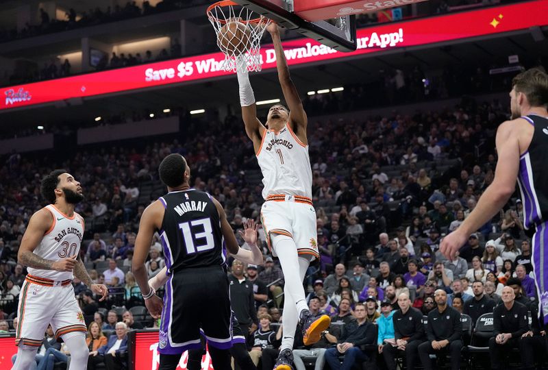 SACRAMENTO, CALIFORNIA - FEBRUARY 22: Victor Wembanyama #1 of the San Antonio Spurs slam dunks against the Sacramento Kings in the first quarter at Golden 1 Center on February 22, 2024 in Sacramento, California. NOTE TO USER: User expressly acknowledges and agrees that, by downloading and or using this photograph, User is consenting to the terms and conditions of the Getty Images License Agreement. (Photo by Thearon W. Henderson/Getty Images)