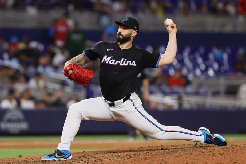 Jul 19, 2024; Miami, Florida, USA; Miami Marlins relief pitcher Tanner Scott (66) delivers a pitch against the New York Mets during the ninth inning at loanDepot Park. Mandatory Credit: Sam Navarro-USA TODAY Sports