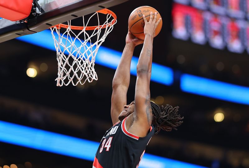 ATLANTA, GEORGIA - MARCH 27:  Jabari Walker #34 of the Portland Trail Blazers attacks the basket against the Atlanta Hawks during the first quarter at State Farm Arena on March 27, 2024 in Atlanta, Georgia.  NOTE TO USER: User expressly acknowledges and agrees that, by downloading and/or using this photograph, user is consenting to the terms and conditions of the Getty Images License Agreement.  (Photo by Kevin C. Cox/Getty Images)