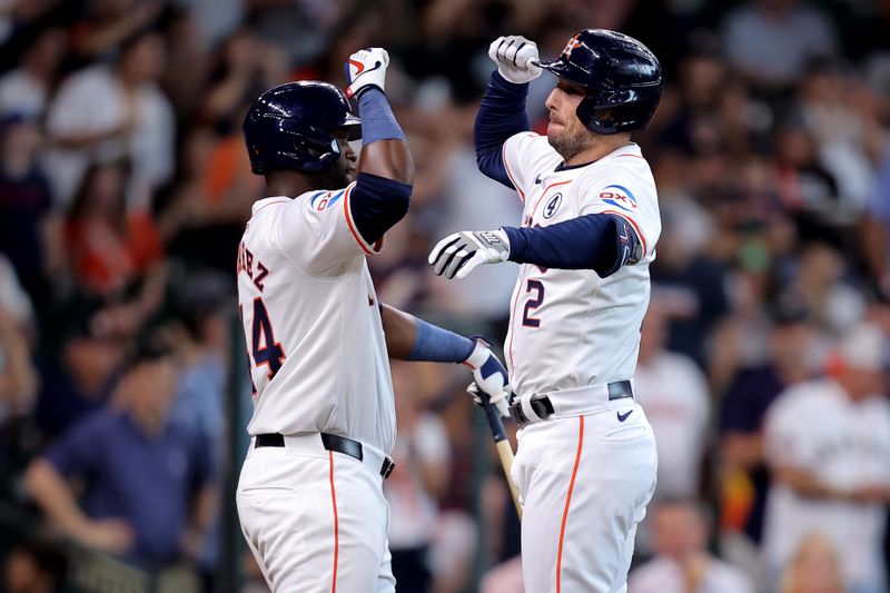 Jun 2, 2024; Houston, Texas, USA; Houston Astros third baseman Alex Bregman (2) celebrates with left fielder Yordan Alvarez (44) after hitting a two-run home run against the Minnesota Twins during the third inning at Minute Maid Park. Mandatory Credit: Erik Williams-USA TODAY Sports