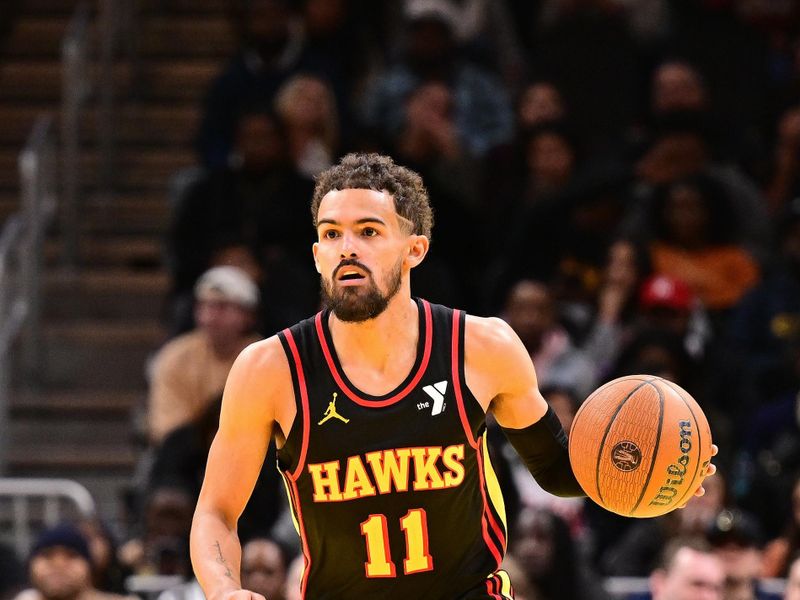 ATLANTA, GA - NOVEMBER 29: Trae Young #11 of the Atlanta Hawks brings the ball up court during the game against the Cleveland Cavaliers during the Emirates NBA Cup game on November 29, 2024 at State Farm Arena in Atlanta, Georgia.  NOTE TO USER: User expressly acknowledges and agrees that, by downloading and/or using this Photograph, user is consenting to the terms and conditions of the Getty Images License Agreement. Mandatory Copyright Notice: Copyright 2024 NBAE (Photo by Adam Hagy/NBAE via Getty Images)